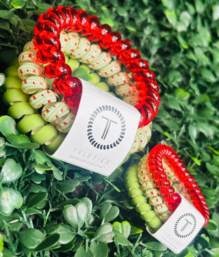 Pack Contents | Set of 3 (solid green, red and tomato design)
Sizes Available | Small and Large
Grip | Strong hold, no-rip spiral design
Hair-Friendly | Prevents breakage, creases, and headaches
Wearability | Doubles as a wrist accessory
Durability | Waterproof and built for everyday use
Color | Locally Grown