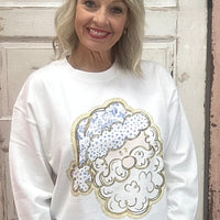 Where festive meets fabulously chic! 🎅✨ Our Toile Tidings Santa Sweatshirt is the ultimate mix of cozy comfort and Christmas charm. This snowy white beauty features a vintage-inspired toile Santa with dot detailing and a shimmering gold outline for that perfect holiday sparkle. The DTF printed side bow cutouts give serious gift-wrap goals—making this sweatshirt a total showstopper for the season.