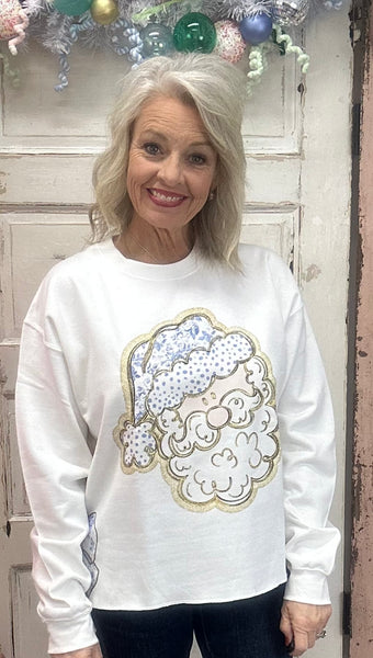 Where festive meets fabulously chic! 🎅✨ Our Toile Tidings Santa Sweatshirt is the ultimate mix of cozy comfort and Christmas charm. This snowy white beauty features a vintage-inspired toile Santa with dot detailing and a shimmering gold outline for that perfect holiday sparkle. The DTF printed side bow cutouts give serious gift-wrap goals—making this sweatshirt a total showstopper for the season.