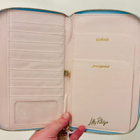 Lilly Pulitzer zipper wallet, Bamboo Logo Trellis wallet, travel organizer wallet, passport wallet, Lilly Pulitzer travel accessories, zipper wallet with pockets, stylish travel wallet. Lilly Pulitzer Bamboo Logo Trellis zipper wallet with gold logo plaque and bamboo zipper pull, designed for travel essentials