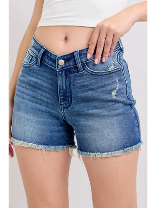Trendy, flattering, and made for your best warm-weather days. The Judy Blue V-Front Shorts with Shield Pockets bring a fresh, fashion-forward twist to classic denim — a unique V-front design, shield pockets, and a high waistline create a contemporary, refined silhouette that works effortlessly from casual everyday wear to spring and summer outings. Crafted from a 93% Cotton / 5% Polyester / 2% Spandex blend, they offer a comfortable fit and easy movement all day long.