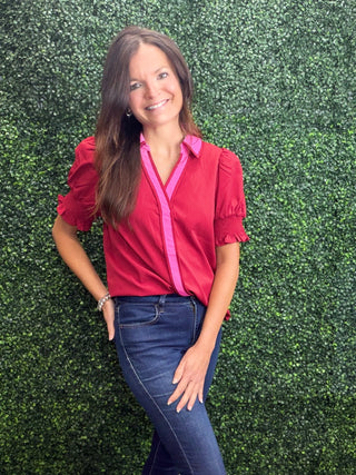 Key Details | Wine body with pink collar and pink center placket detailing
Sleeves | Short puff sleeves with smocked ruffle cuffs
Neckline | Collared neck
Fabric | 60% Viscose, 40% Polyester — soft, lightweight, and comfortable
Fit | Relaxed through the body with a flattering drape