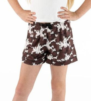 Cozy just got cuter. These Simply Southern youth PJ shorts are made for all-day comfort — whether she’s lounging at home, having a sleepover, or just needs her softest pair of shorts. The cow print adds a fun, playful touch that kids will love.

Key Details | Cow print pattern
Waistband | Full elastic waistband with adjustable drawstring for a comfortable, customized fit
Inseam | 3"
Fabric | 95% Cotton, 5% Spandex — ultra-soft, breathable, and easy to move in
Brand | Simply Southern