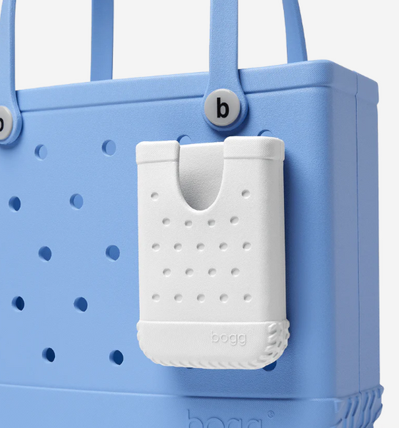 Meet Call Me Bogg—your stylish sidekick for keeping your phone secure and exactly where you need it. Crafted from durable, antimicrobial EVA, this phone holder snaps into any hole in your Bogg Bag, so your phone is always at your fingertips (say goodbye to rummaging!). Lightweight and water-resistant, Call Me Bogg keeps your essentials close, clean and easy to grab—so you’re ready for whatever the day brings.