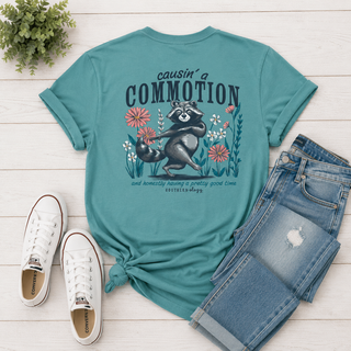 Graphic | Dancing raccoon with bright florals and "causin' a commotion" saying
Color | Seafoam
Neckline | Crew neck
Sleeve | Short sleeve
Fabric | Comfort color, soft and worn-in feel
Brand | Southernology
Care | Machine wash cold, tumble dry low