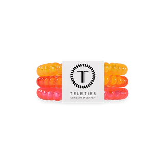 Meet your new year-round hair essential! The&nbsp;TELETIES Hair Coils deliver a strong grip without damage, keeping your style secure all day long. When not in your hair, they double as a chic wrist accessory—functional and fashionable in one.

🌟 Why You’ll Love Them:

✅ Strong grip, no-rip design for all-day hold

✅ Doubles as a stylish bracelet

✅ Durable &amp; waterproof for all occasions

✅ Gentle on hair—prevents breakage, headaches, and creases

✅ Sold in packs of three

Pink, Orange & Yellow hairtie