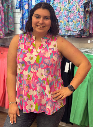 Bold color, effortless style. This vibrant magenta floral tank features an A-line bodice with a split neckline and mandarin collar — flowy enough to keep you cool, polished enough to take you anywhere the warm season leads.
