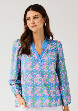 The Gianna Top adds personality to an everyday essential. Designed with a button-front placket, long sleeves with elastic cuffs, and a ruffle neckline, it’s easy to wear and full of charm. Pair it with your favorite denim for laid-back days or style it with tailored pieces for a dressed-up look that still feels effortless.