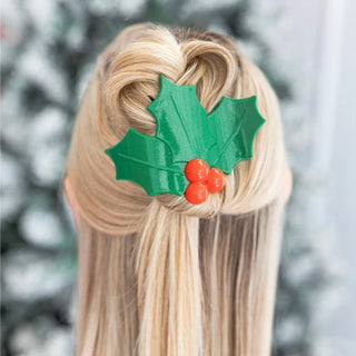 Design | Green holly leaf shape with bright red berries and a glitter finish.
Comfort | Flat-back profile stays comfortable against car seats, couches, and pillows.
Hold | Bendable teeth flex to your hair for a secure hold without pulling or snagging.
Material Feel | Lightweight, flexible, and nearly unbreakable for daily wear and travel.
Hair Types | Designed to work on all hair types.