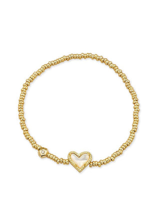 Brand | Kendra Scott
Metal | 14k yellow gold over brass
Material | Ivory Mother of Pearl
Design | Heart detail with stretch construction
Size | 6.5-inch unstretched circumference; stations measure 1 inch long by 0.11 inch wide
Care | To help protect the finish, avoid water, perfume, and lotions; gently wipe with a soft cloth after wear.