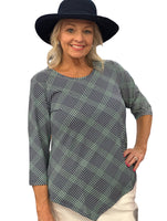 Stay stylish and protected in the Lulu-B Asymmetrical Top, crafted from a stretchy nylon-spandex blend. This flattering scoop-neck top features 3/4 sleeves and a chic asymmetrical hemline. With built-in UPF 50 sun protection and pre-shrunk fabric, it's perfect for sunny days, travel, or everyday wear—easy, polished, and effortlessly comfortable.


