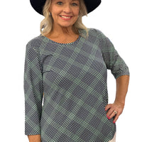 Stay stylish and protected in the Lulu-B Asymmetrical Top, crafted from a stretchy nylon-spandex blend. This flattering scoop-neck top features 3/4 sleeves and a chic asymmetrical hemline. With built-in UPF 50 sun protection and pre-shrunk fabric, it's perfect for sunny days, travel, or everyday wear—easy, polished, and effortlessly comfortable.

