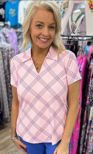 Elevate your wardrobe with the Lulu B Short Sleeve V-Neck Top with Collar, featuring butter-soft, wrinkle-free fabric that offers both luxury and practicality. This top is designed with UPF 50+ sun protection, making it a must-have for sunny days and travel. The added collar gives it a polished, sophisticated look, while the lightweight, breathable fabric ensures all-day comfort. Ideal for both casual outings and more dressed-up moments, this top packs neatly without wrinkles, so you can always look put tog