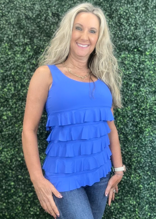Turn heads with the flirty and fun Cha Cha Tank! Designed with soft, stretchy fabric and UPF50 protection, this feminine favorite features front and back ruffles, a scoop neckline, and a straight hemline at the waist. At 30.5" long, it pairs perfectly with any bottoms for effortless summer style. Machine washable and hang dry for easy care—add a little cha cha to your wardrobe today!