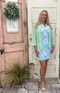 Stay stylish and sun-safe in this sleeveless dress with a scalloped neckline. Made with UPF50 cooling fabric, it offers comfort, protection & effortless charm.