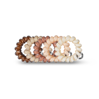 Pack Contents | 5 Tiny hair ties
Design | Mini spiral coils with a strong, no-rip grip
Best For | Super-thin hair, smaller sections, and little kids’ hairstyles
Durability | Durable and waterproof
Size | Fits an adult finger like a ring rather than a wrist like a bracelet
Style | For the Love of Nudes