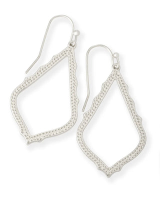 Metal | Rhodium plated over brass
Design | Delicate metallic frame with dainty details
Dimensions | 1.75" L x 0.82" W on earwire
Closure | Earwire
Style | Silver drop earrings