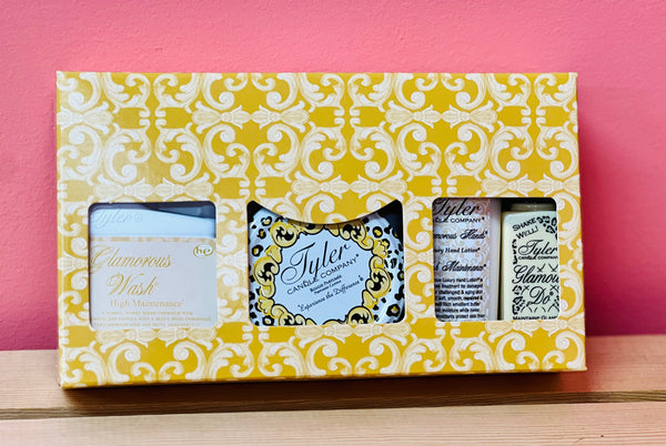 The Glamorous Gift Set IV includes a candle, Glamorous Wash, hand lotion, and Glamour Do Spray—perfect for a luxurious fragrance experience anytime, anywhere!







